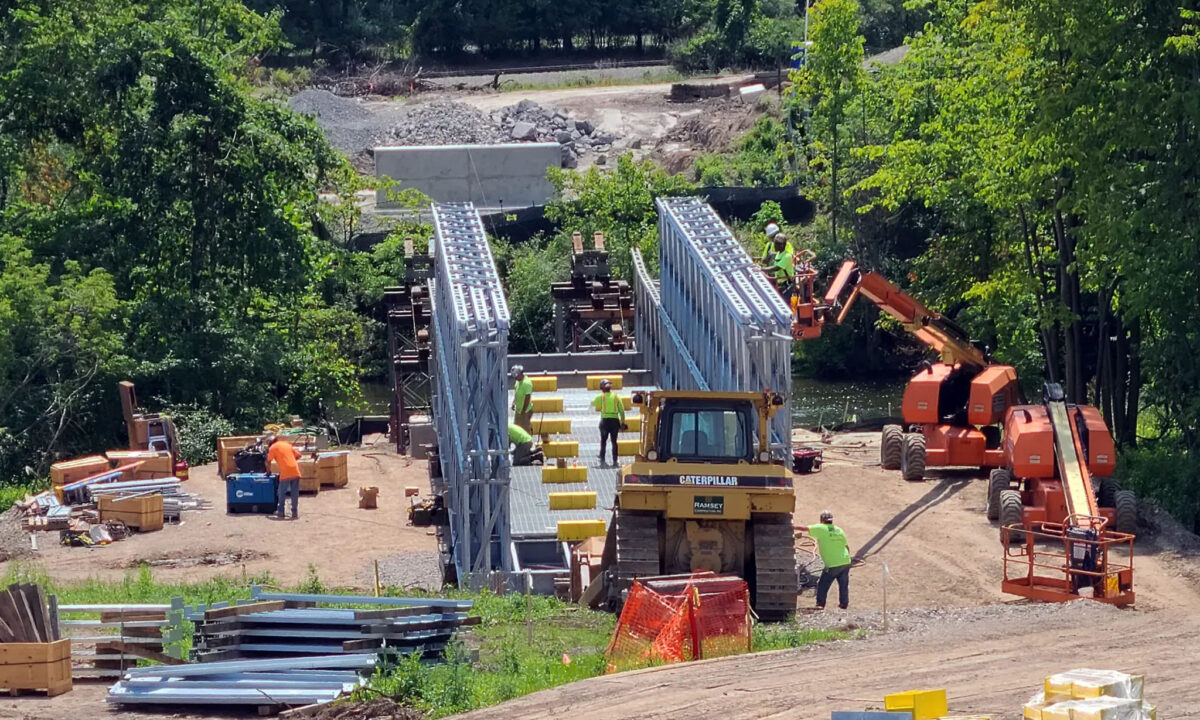 BVR assembles a bridge over land and translated using rollers on towers across the Oatka Creek.