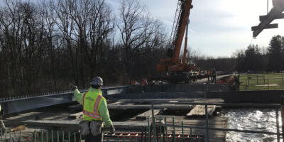 construction of steel bridge erection over the hemlock lake outlet